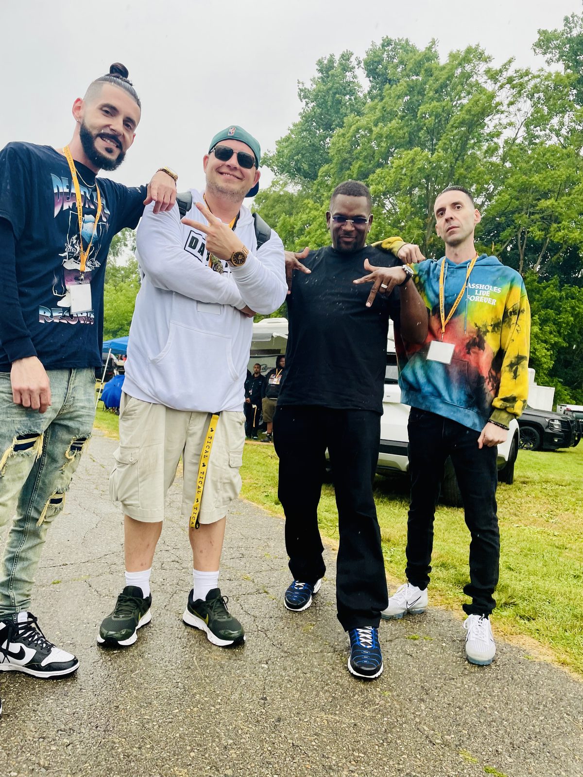 KING T and LUSS with two other artists outdoors at a festival