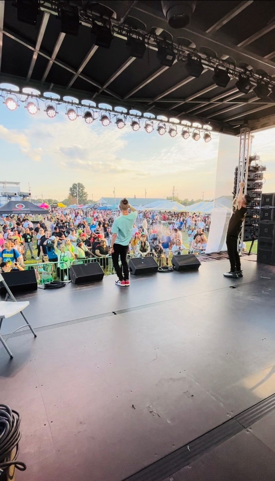 A TNL performer on a sunset stage in front of the crowd