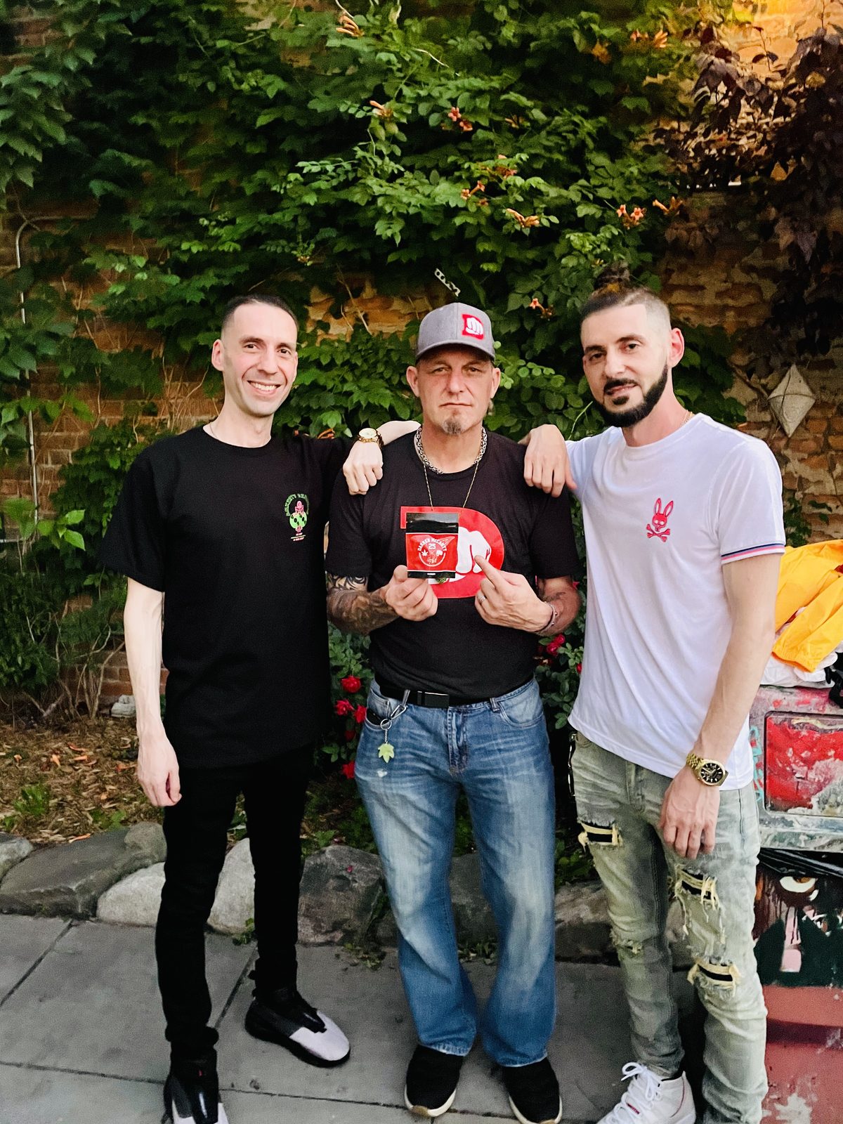 KING T and LUSS with Darren McCarty in front of trees